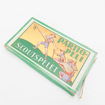 Two Finnish girl scouts uniforms with accessories and a boardgame, mid-second half of 20th Century.