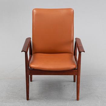 Finn Juhl, a rosewood easy chair, from Cado, Denmark, 1960's/70's.