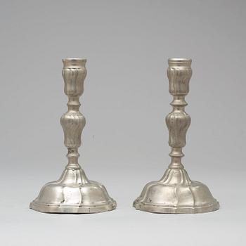A pair of Swedish Rococo pewter candlesticks by F Ahlman 1777.