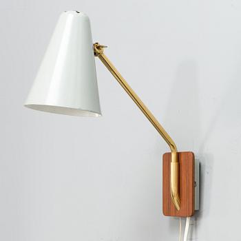 A mid-20th century wall light for Valinte.