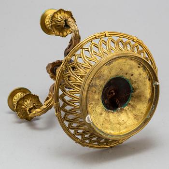 A Louis XVI-style bronze candelabrum, 20th century.