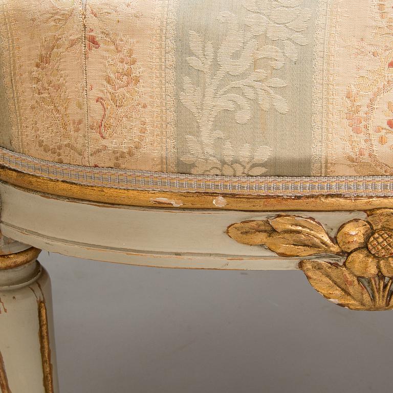 A Gustavian style sofa and table from early 20th century.