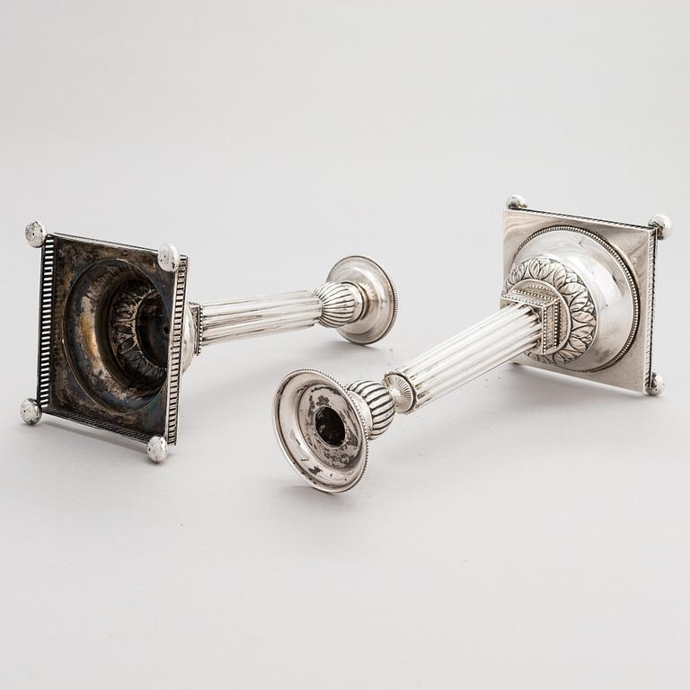 A pair of Swedish silver candlesticks, CG Hallberg, Stockholm 1901 and 1902.