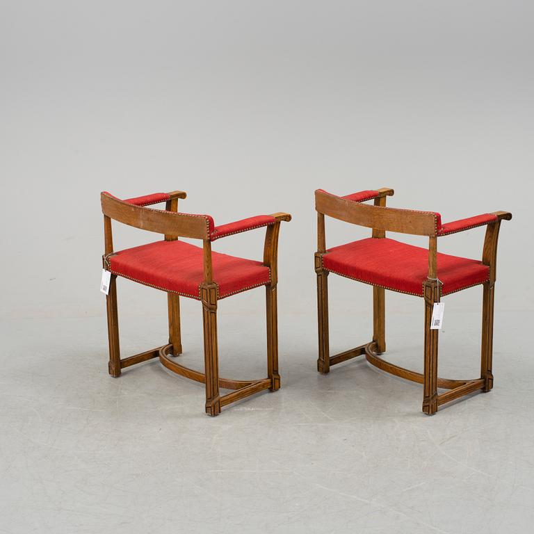 A pair of Carl Bergsten oak armchairs, Nordiska Kompaniet, Sweden 1923.