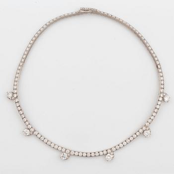 A Cartier necklace in platinum and 18K gold set with round brilliant-cut diamonds.