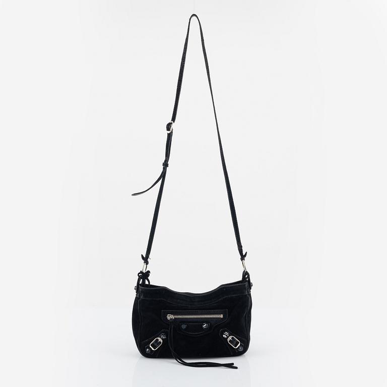 Balenciaga, a black suede 'City' crossbody bag.