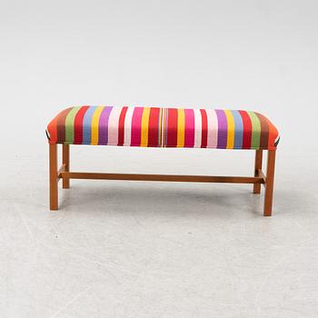 A model 2028 bench by Josef Frank for Firma Svenskt Tenn.