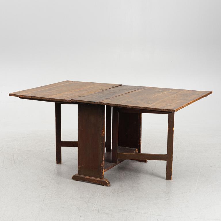 A drop-leaf table, 19th Century.