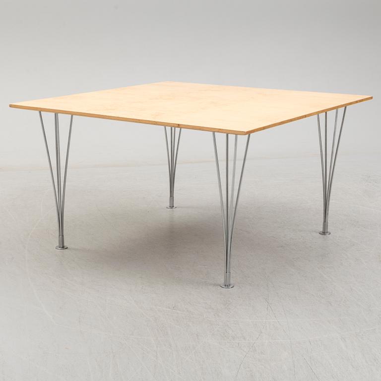 A birch veneered dining table by Bruno Mathsson and Piet Hein.