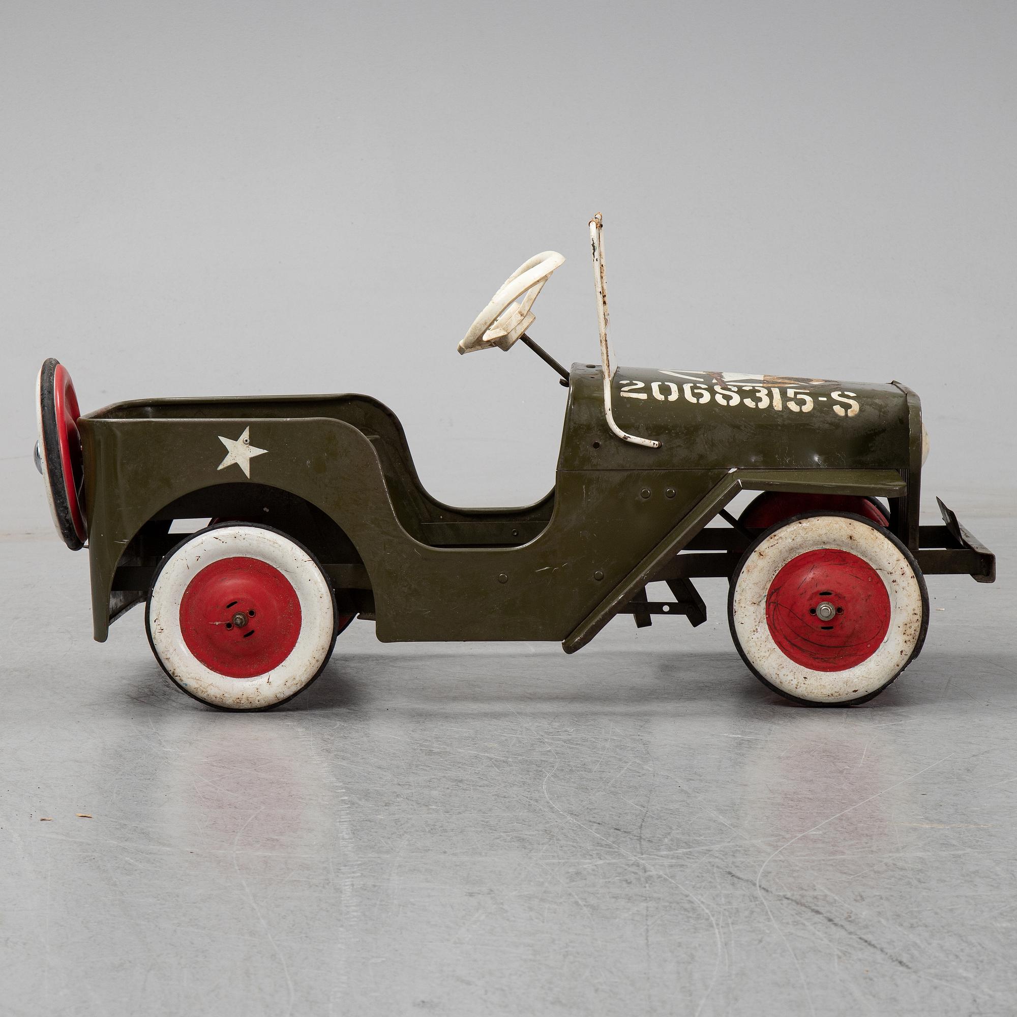 A sheet metal pedal car from the second half of the 20th century.