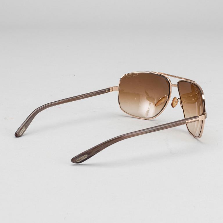 Two pair of Tom Ford Sunglasses.