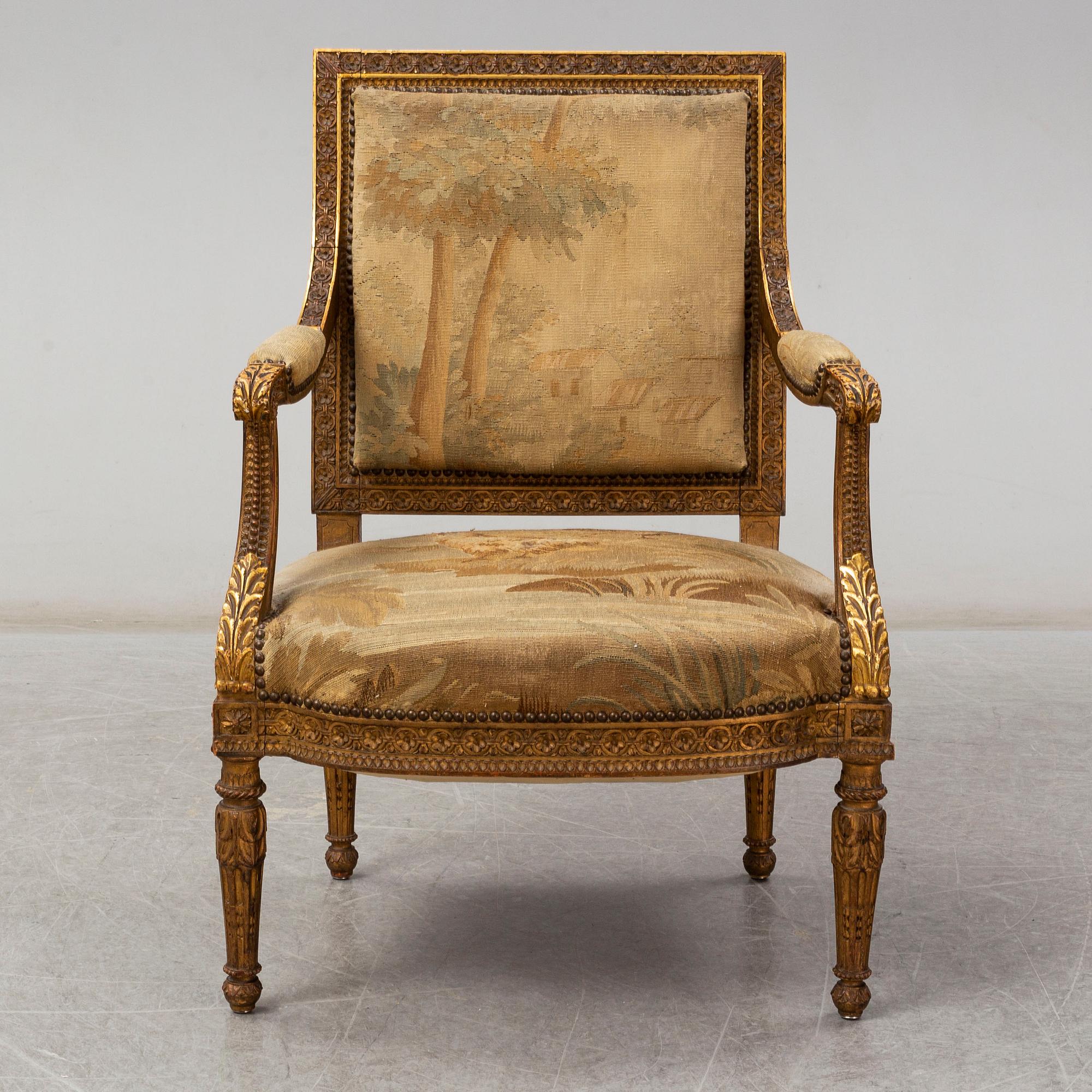 A late 19th century Louis XVI-style armchair.