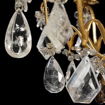 A near pair of Franch Louis-XV-style nine-branch gilt bronze and rock crystal chandeliers, later part 19th century.