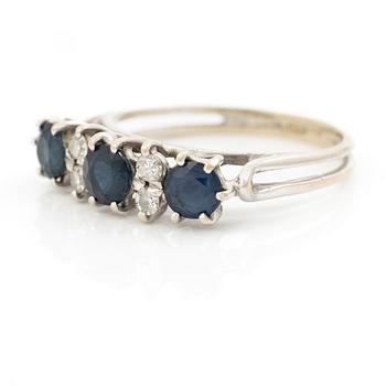 Ring, 18K white gold, set with three sapphires and single-cut diamonds.