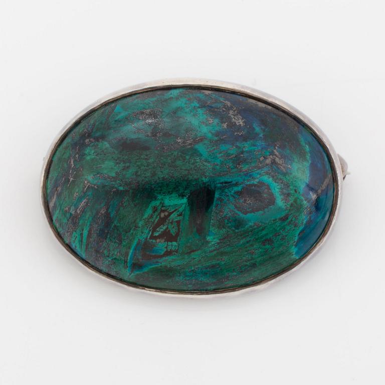 Cecilia Johansson, silver and cabochon cut green blue stone.