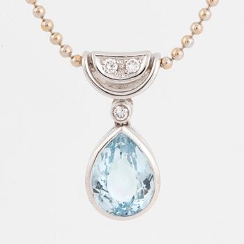 White gold chain and pendant with pearshaped topaz and brilliant-cut diamonds.