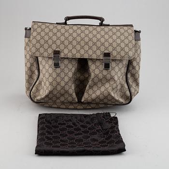 Gucci, a messenger bag.