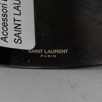 YVES SAINT LAURENT, a metal bangle.