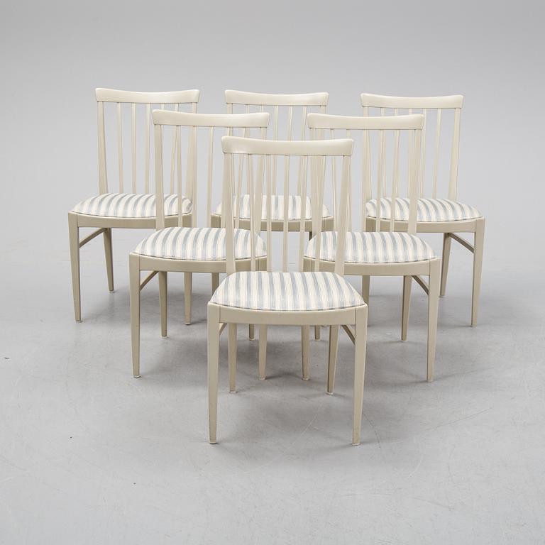 A dining table and six chairs by Carl Malmsten for Bodafors.