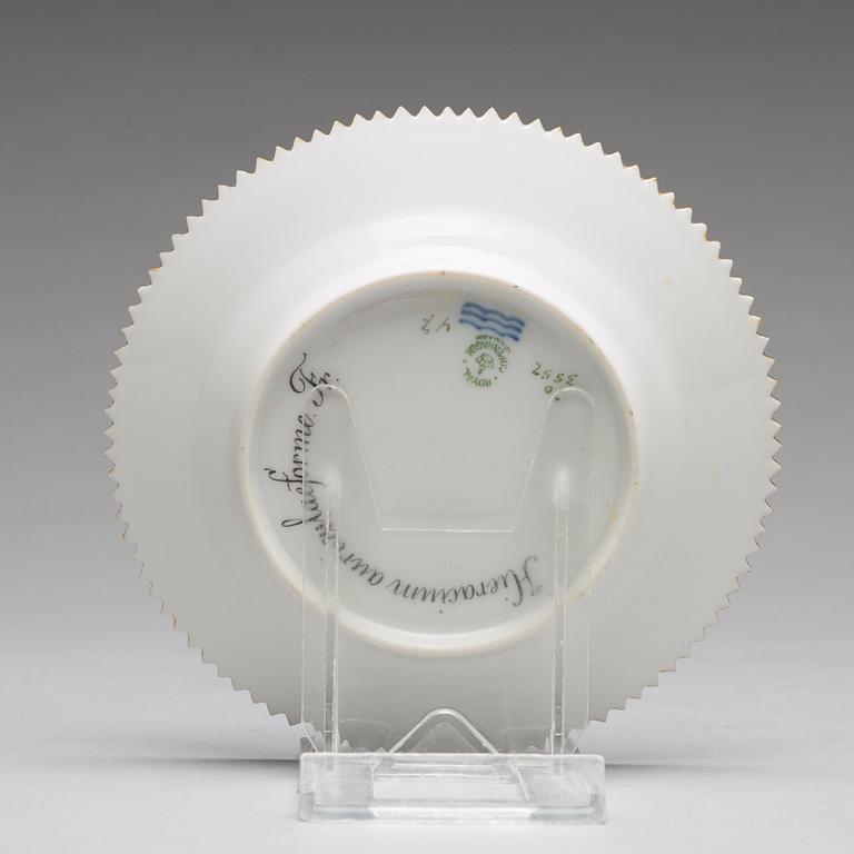 A set of 12 Royal Copenhagen "Flora Danica" bread dishes, Denmark, 20th Century.