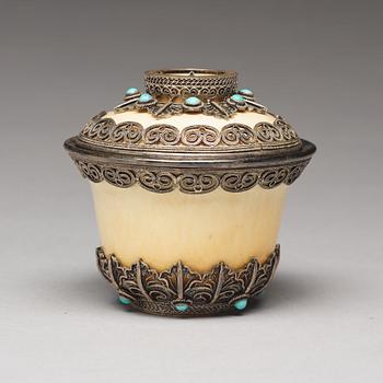 A bejewelled tibetan silver and turkoise bowl with cover, 19th Century.