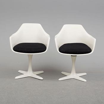 A dining table and eight chairs by Robin Day, Arkana.