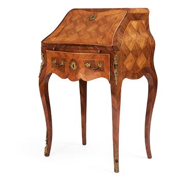 25. A rococo parquetry secretaire, Stockholm, later part of the 18th century.