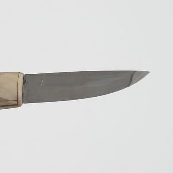 Sven-Åke Risfjell, a reindeer horn knife, signed and dated -86.