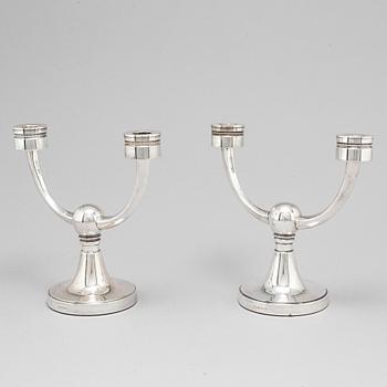 A pair of silver candelabra from MGAB, Uppsala, 1969-71.