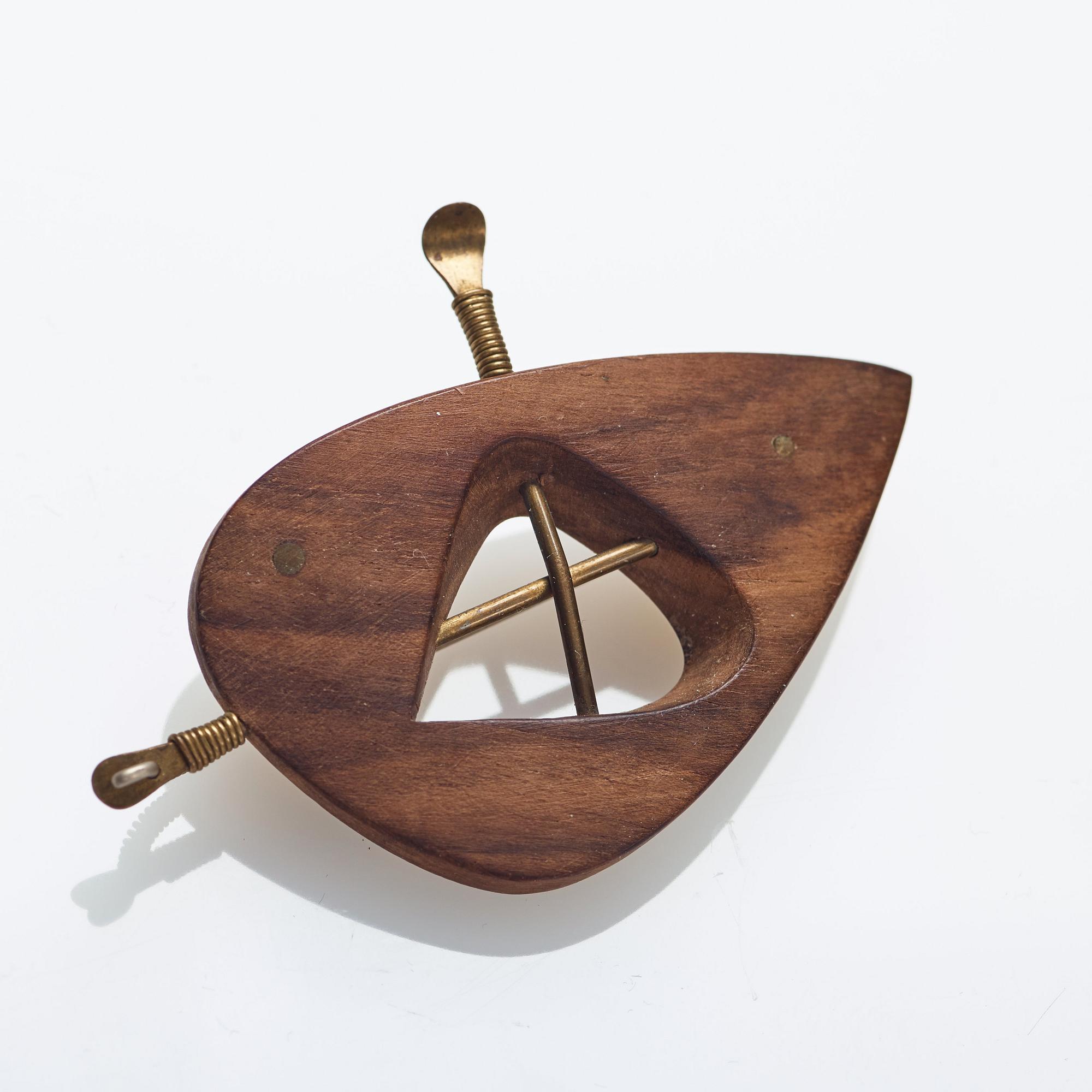 Vivianna Torun Bülow-Hübe, a wooden and brass brooch, executed in her own workshop, Stockholm ca 1948-52.