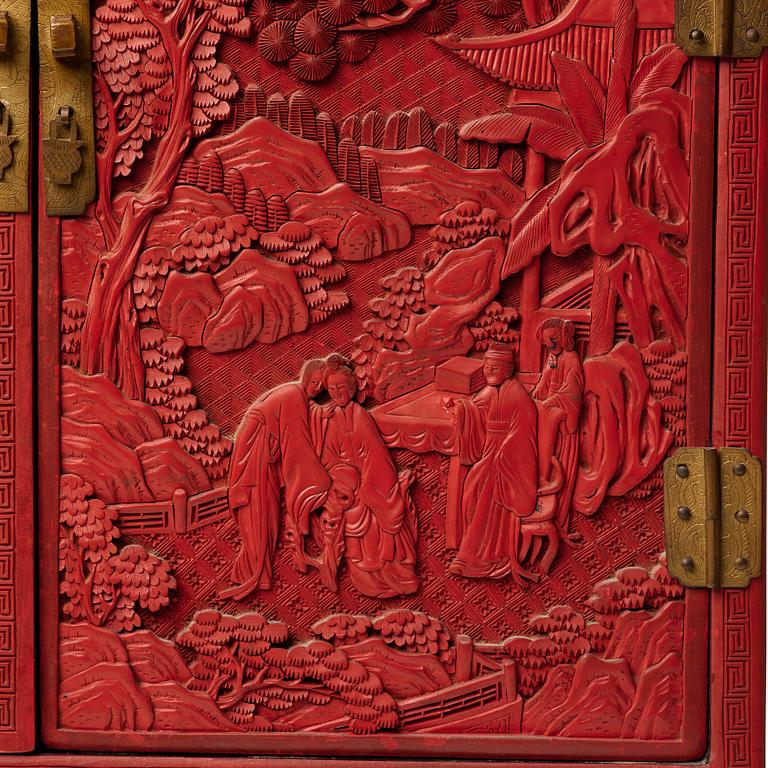 A carved  lacquer 'Kang'Cabinet, Qing dynasty, 18/19th Century.
