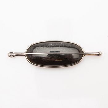 Vivianna Torun Bülow-Hübe, brooch, silver with mother-of-pearl and obsidian.