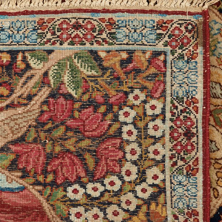 A RUG. A semi-antique Kerman Laver figural. 79,5 x 64,5 cm.