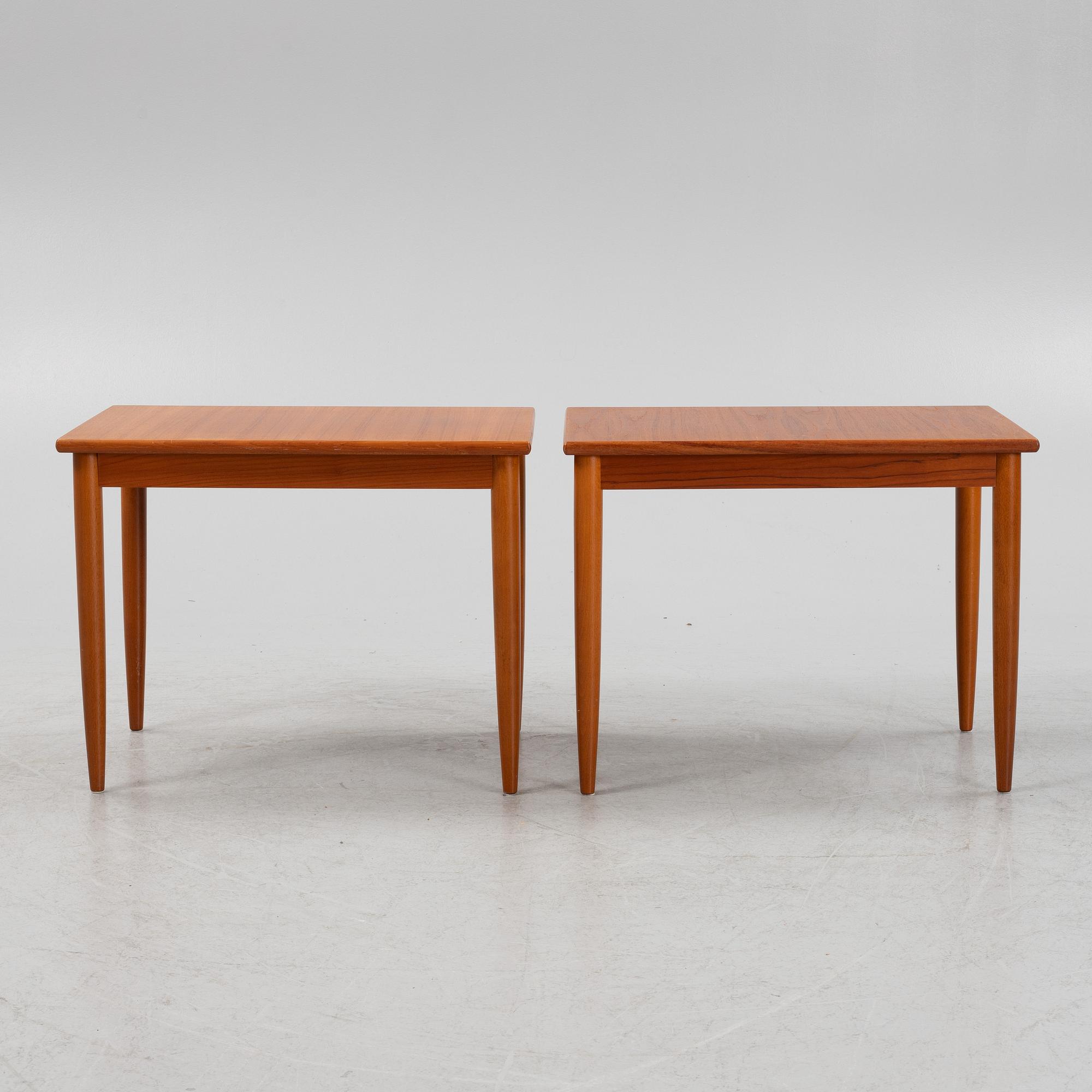 A pair of teak veneered side tables, second part of the 20th Century.
