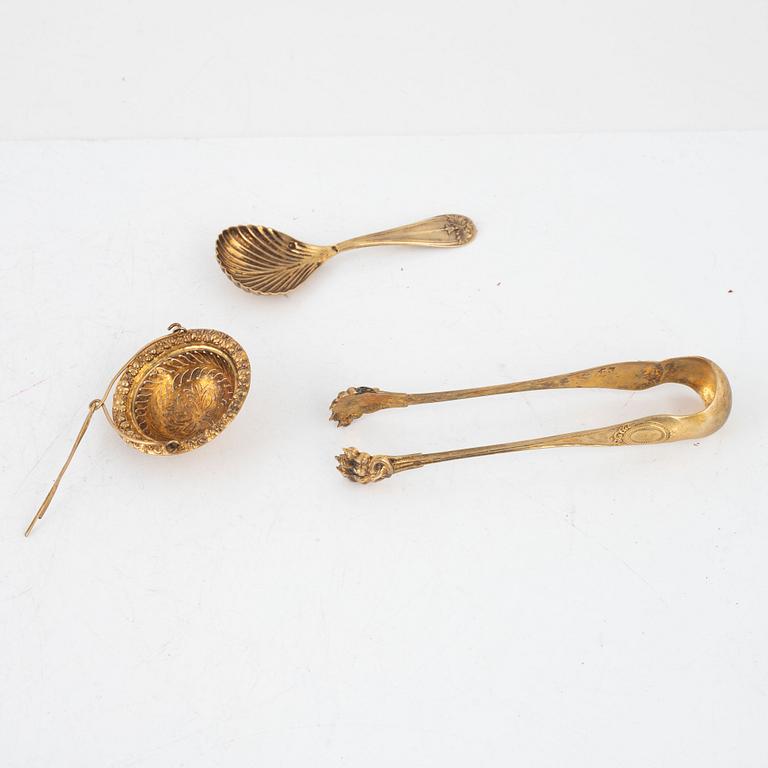 Philippe Berthier, skedar, 13 st, sockertång och tesil, förgyllt silver, Paris, Frankrike, 1841-51.