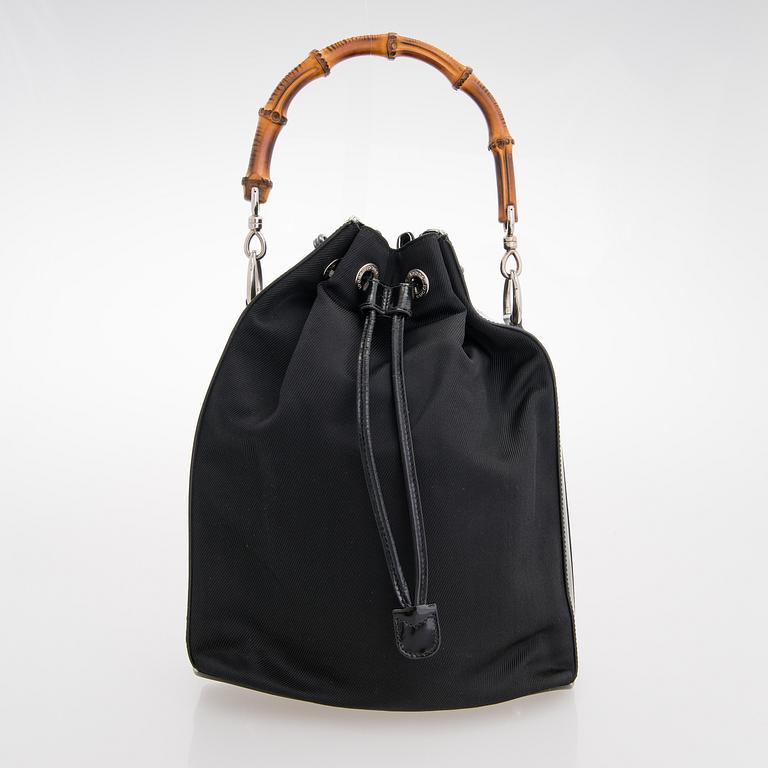 GUCCI, a black nylon handbag.