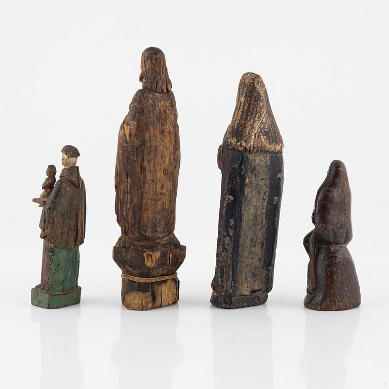 Four wooden sculptures, 18th century or older.