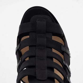 Christian Louboutin, a pair of black silk sandals, size 37 1/2.