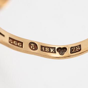 18K gold ring with a blue synthetic stone.