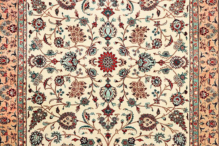 An oriental silk carpet, a. 280 x 185 cm.