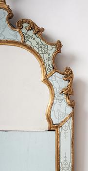 A Baroque gilt-lead and engraved glass mirror in the manner of Burchard Precht, early 18th century.