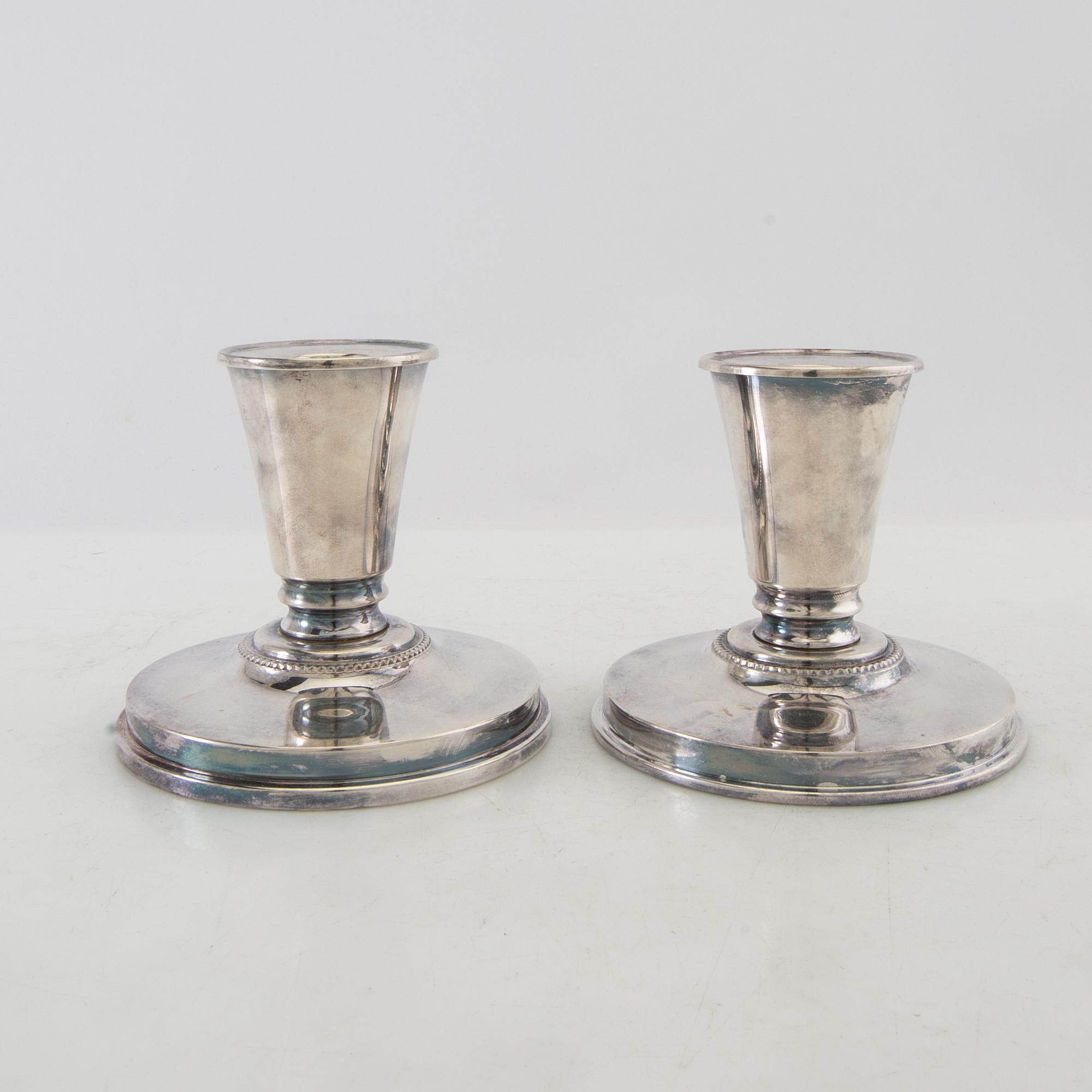 Candelsticks, a pair of silver-plated metal, first half of the 20th century.