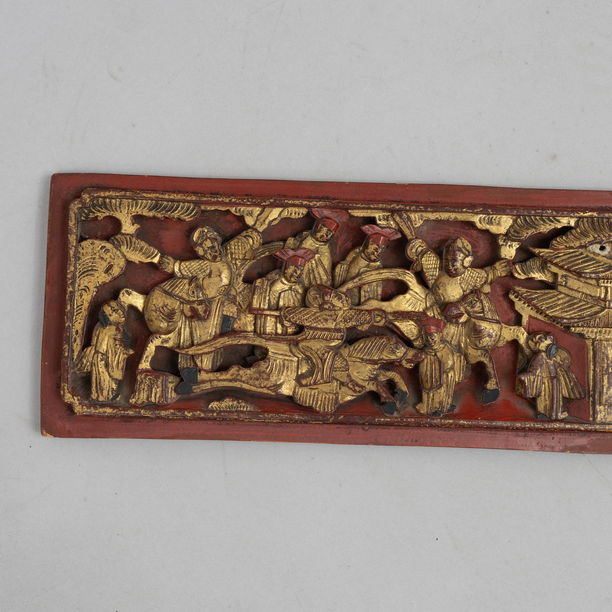 A group of three Chinese wooden panels, late Qing dynasty / around 1900.