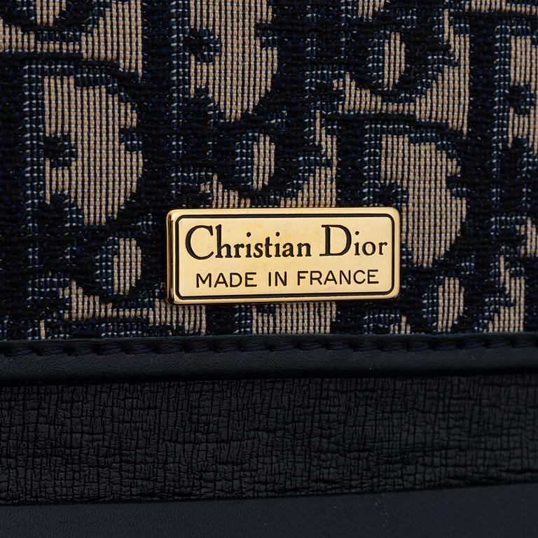 Christian Dior, a canvas clutch.