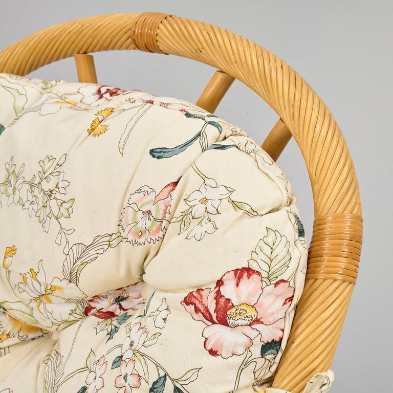 A rattan sofa and two armchairs, later part of the 20th century.