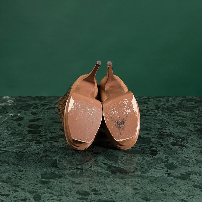 A pair of boots by YVES SAINT LAURENT,in size 37.