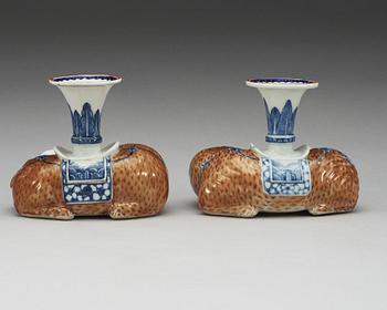 A pair of Export candle sticks in the shape of reclining elephants, Qing dynasty, Qianlong (1736-95).