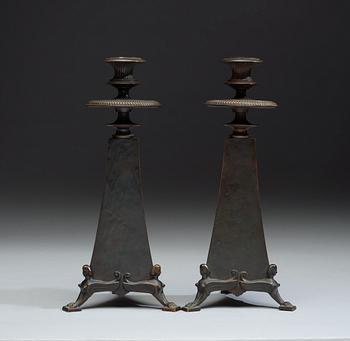 A pair of Melchior Wernstedt bronze candelsticks, foundry Herman Bergman AB.