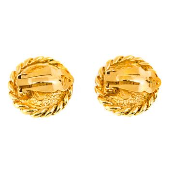 A pair of clips by Chanel.