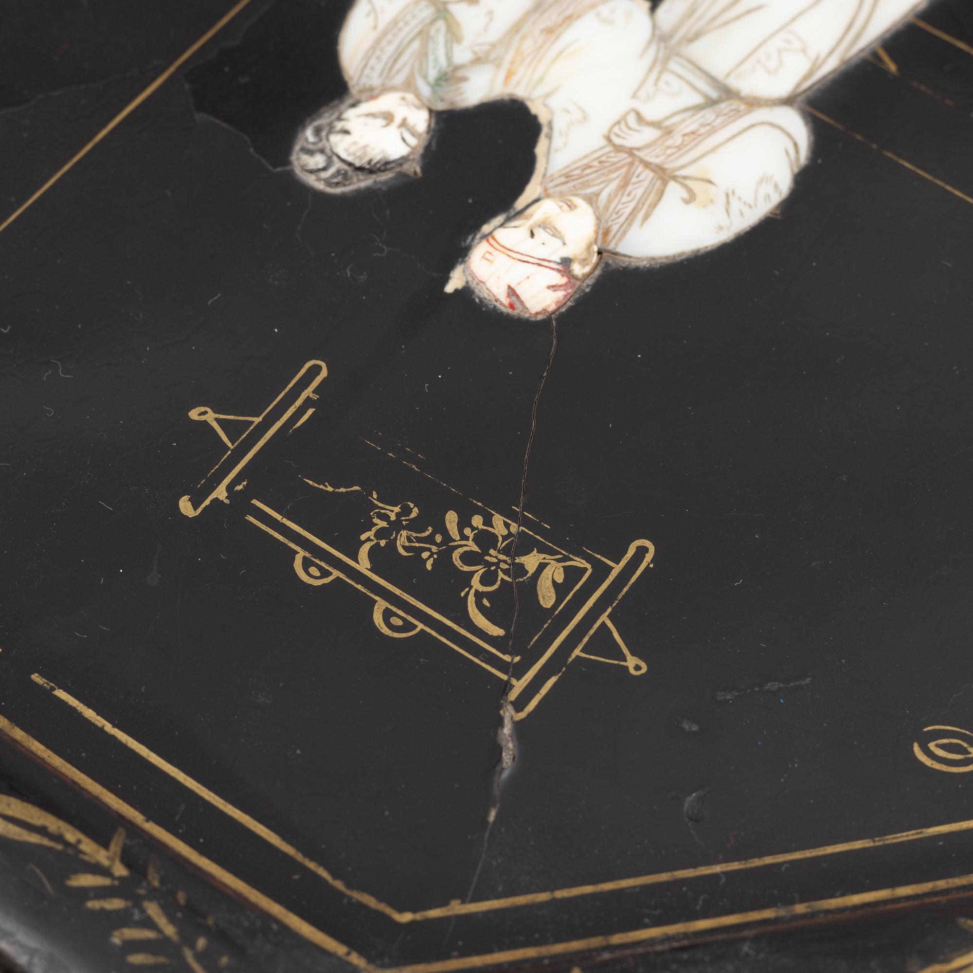 Four black-lacquered wall decorations, China, around 1900.